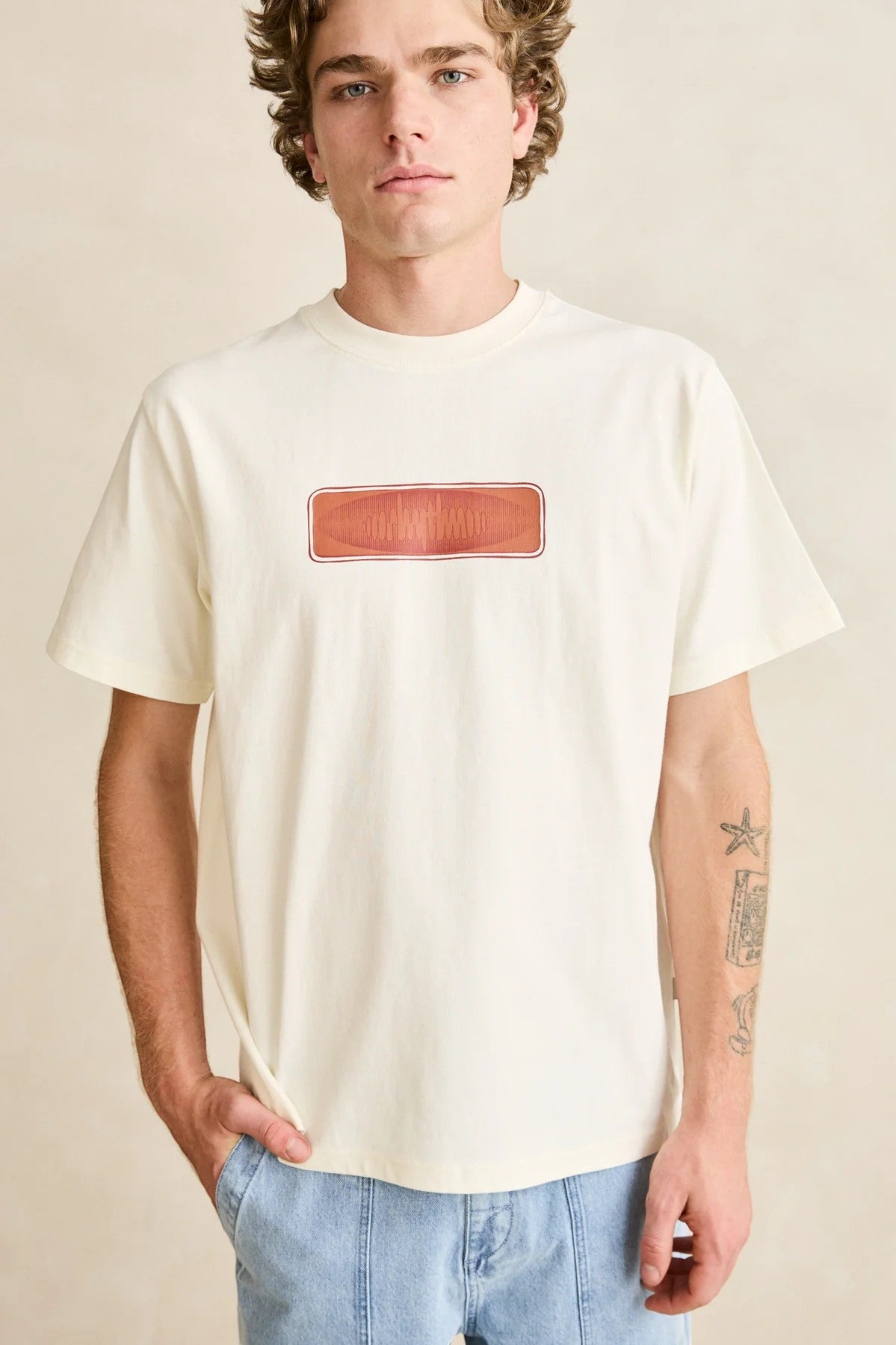 Keel Surf & Supply Tremolo Vintage short-sleeve t-shirt in natural cream cotton with a red graphic logo on the chest.