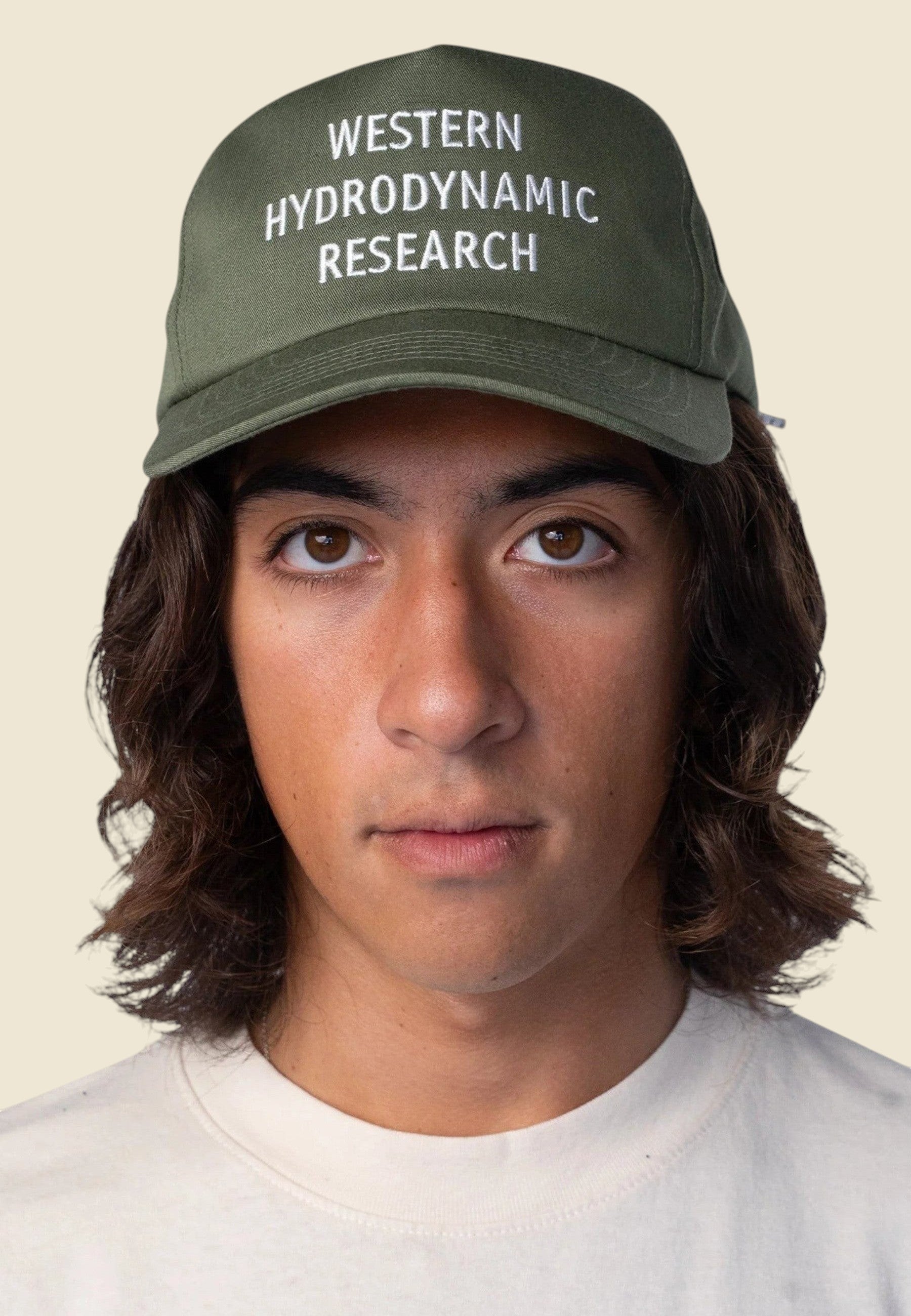 Keel Surf & Supply drab green cotton polyester baseball cap with embroidered Western Hydrodynamic Research logo and bungee closure.