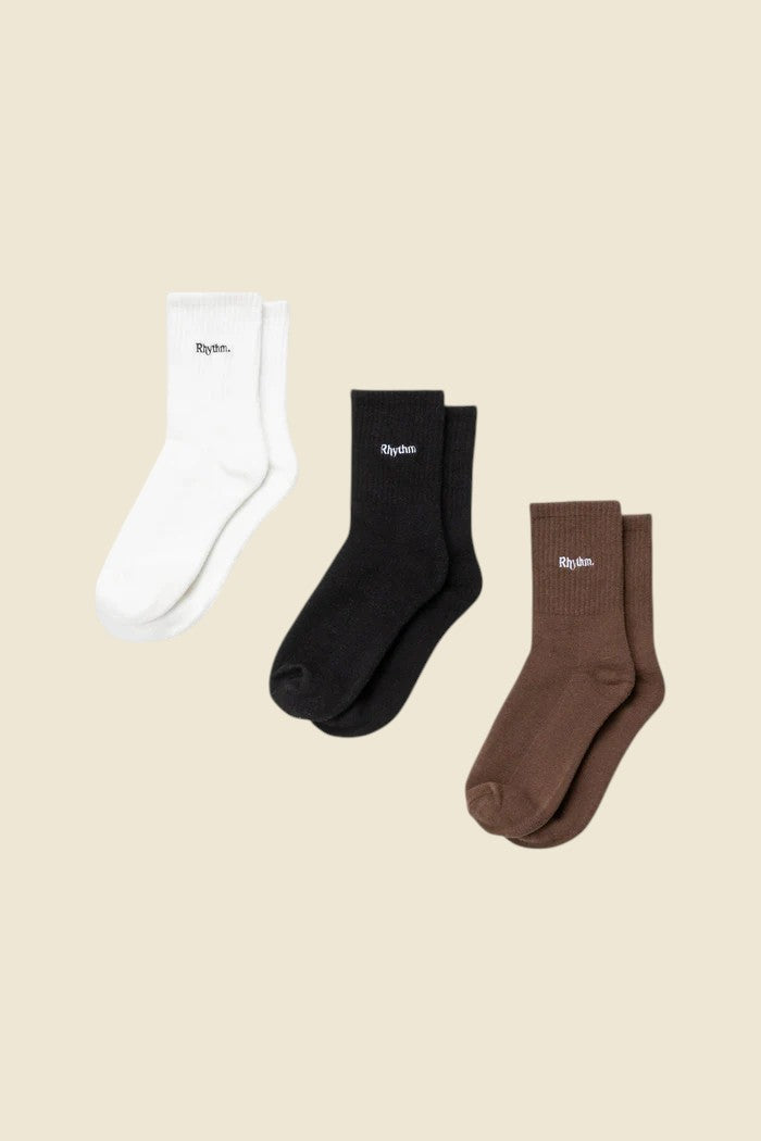 Keel Surf & Supply 3-pack crew socks in white, black, and brown, featuring embroidered logo.
