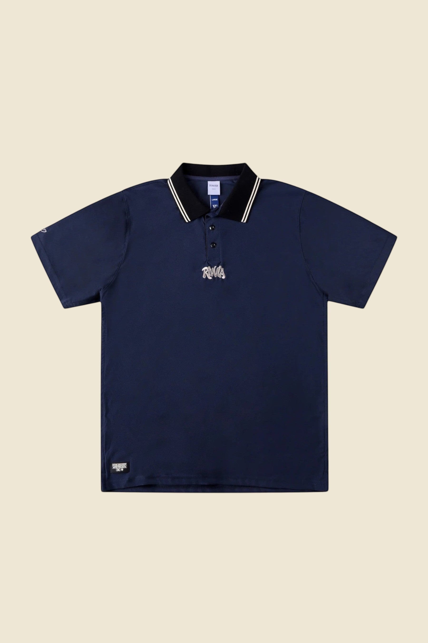 Keel Surf & Supply navy blue polo shirt with black collar featuring white and gold stripes and embroidered logo.