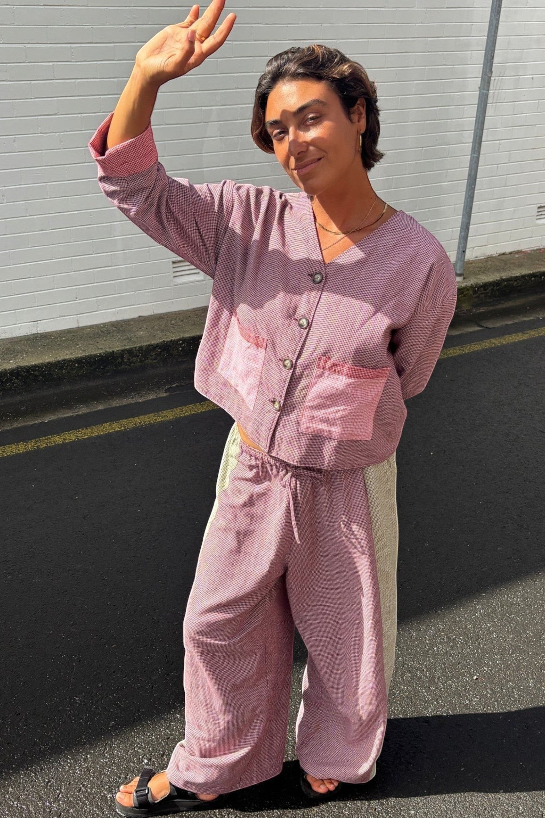 Keel Surf & Supply pink patchwork houndstooth lined overshirt with button front and chest pockets, paired with matching trousers.