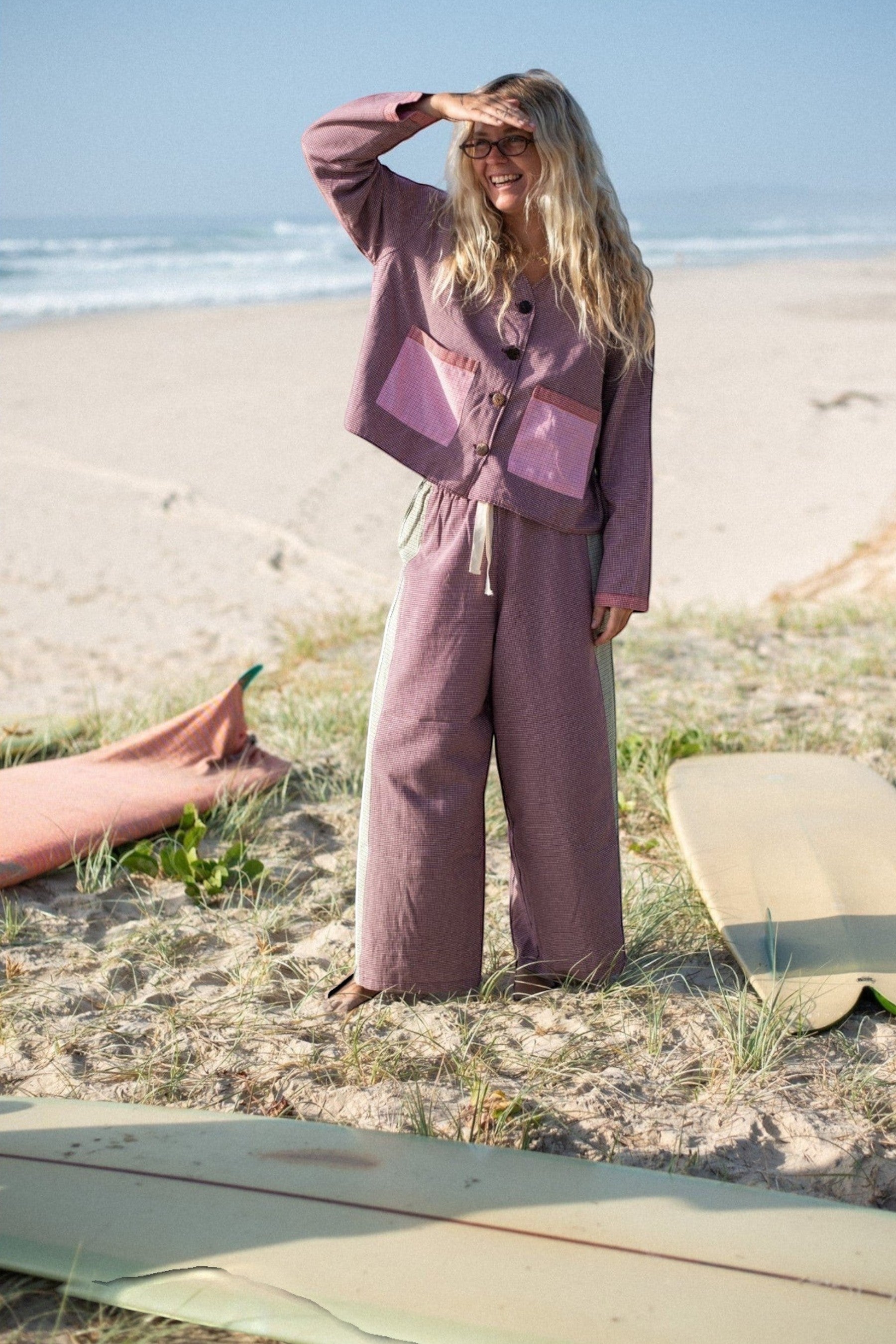 Keel Surf & Supply women's wide-leg patchwork pants in maroon and pink houndstooth cotton with elastic drawstring waist.