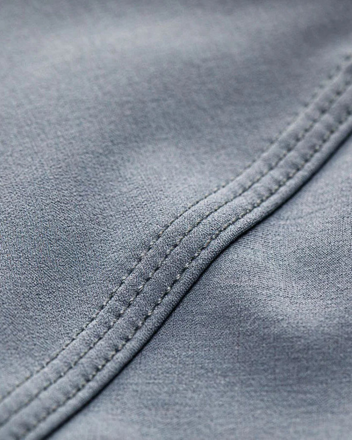 Close-up of gray fabric with stitching detail