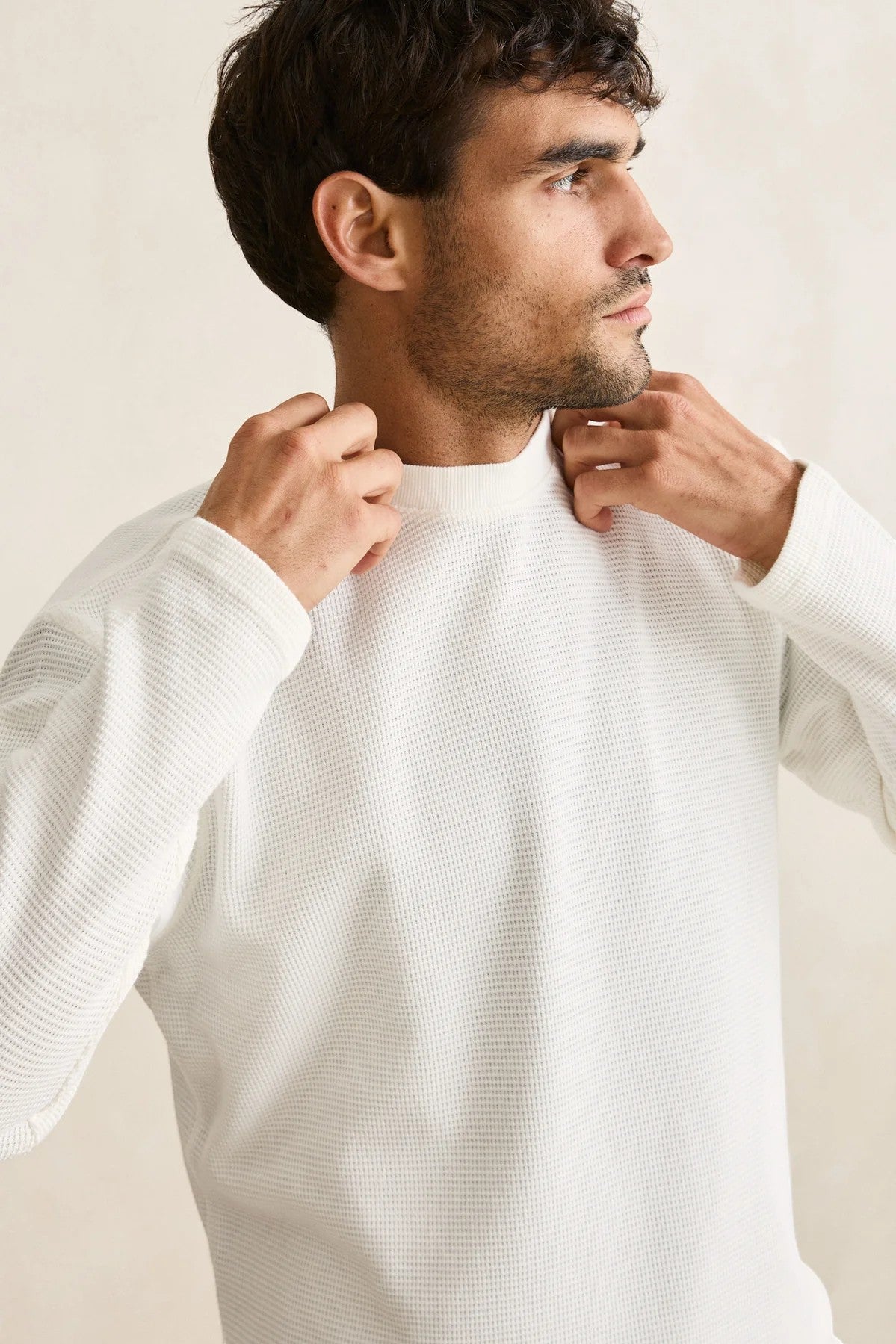 Keel Surf & Supply Rhythm Classic Waffle Knit long-sleeve shirt in vintage white, worn by a man.
