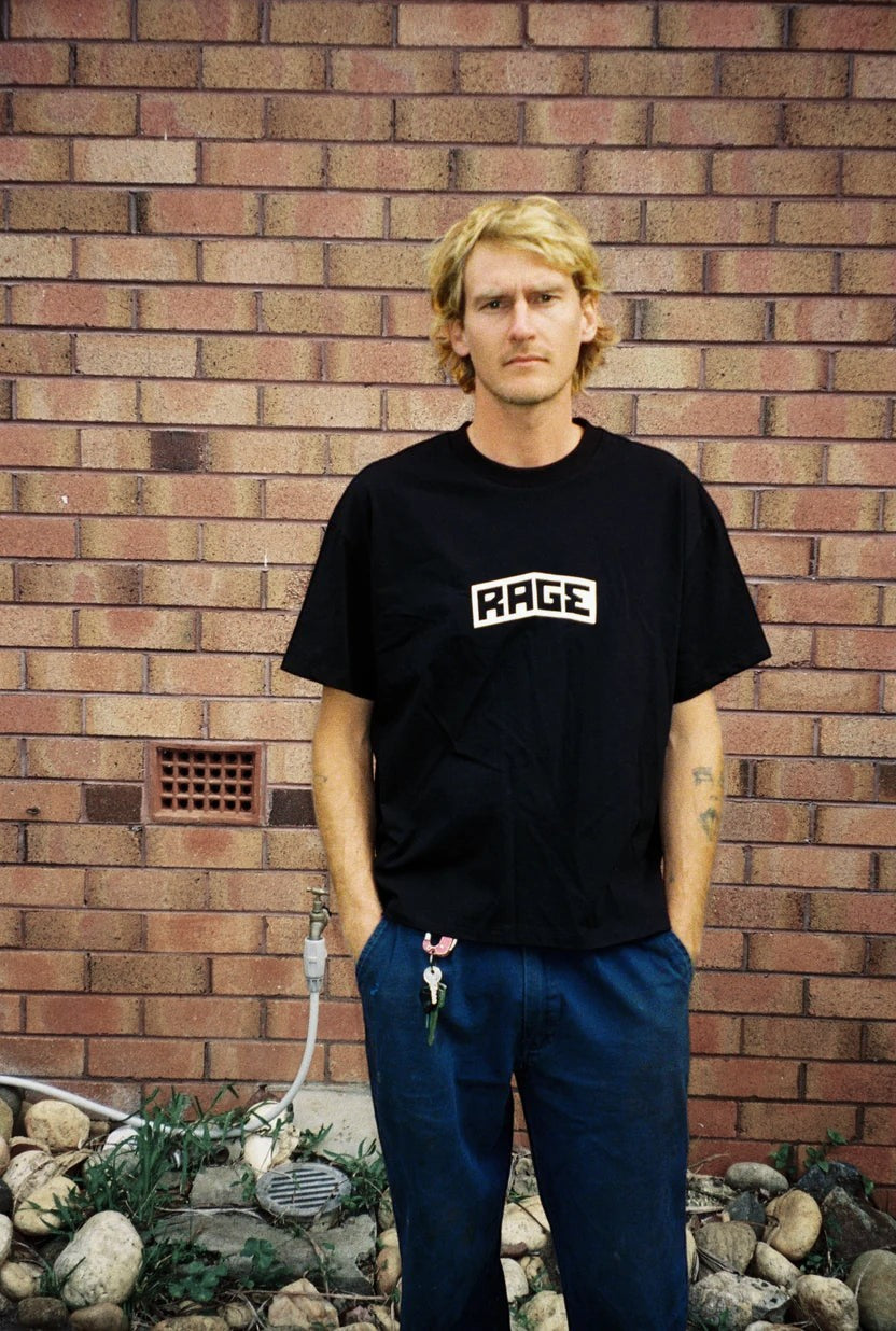 Keel Surf & Supply black 100% cotton t-shirt with white Rage logo graphic on chest. Short sleeves, crew neck.