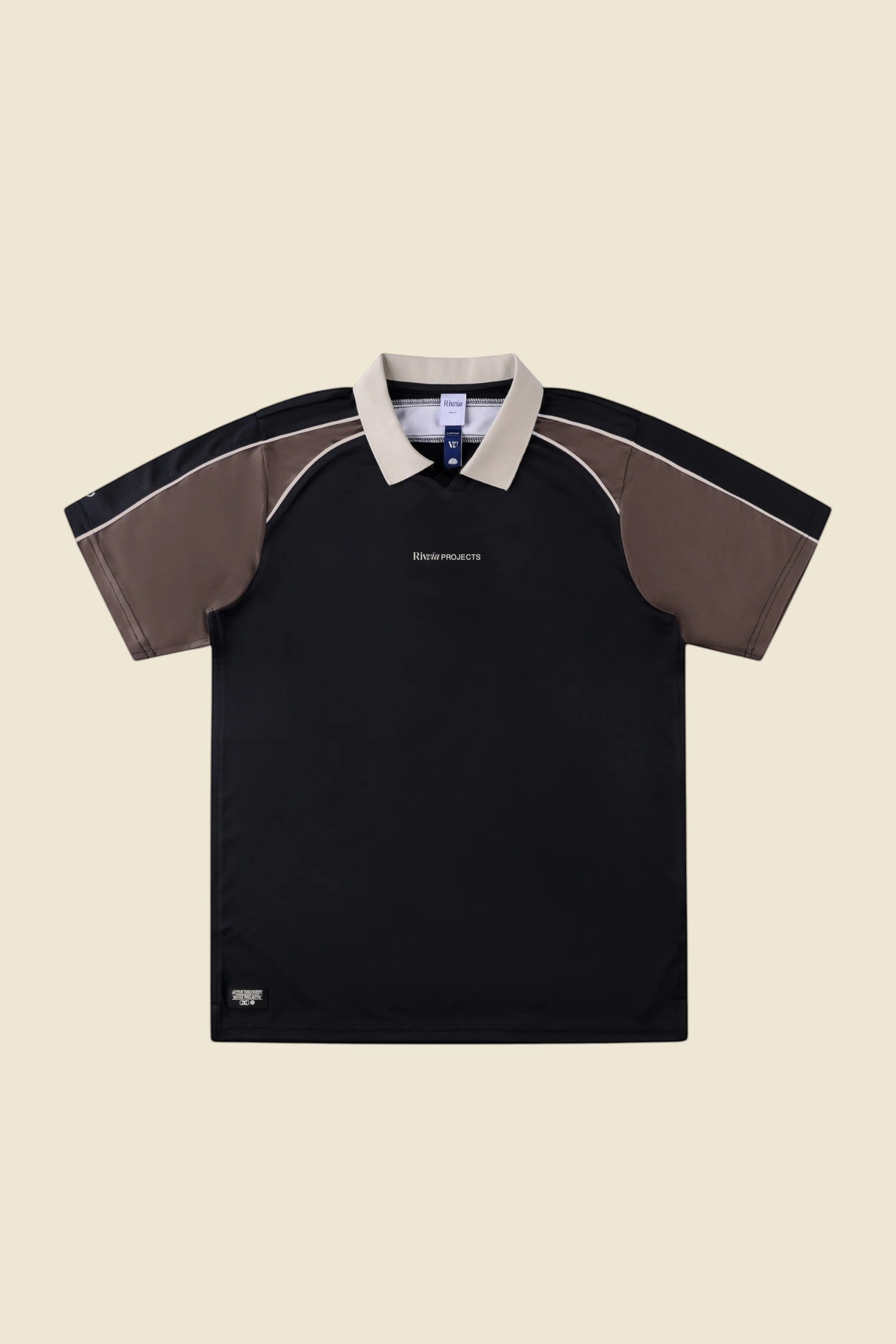 Keel Surf & Supply black polo shirt with brown sleeves, zip collar, and contrast piping. Breathable, stretch fabric with UPF 50+.