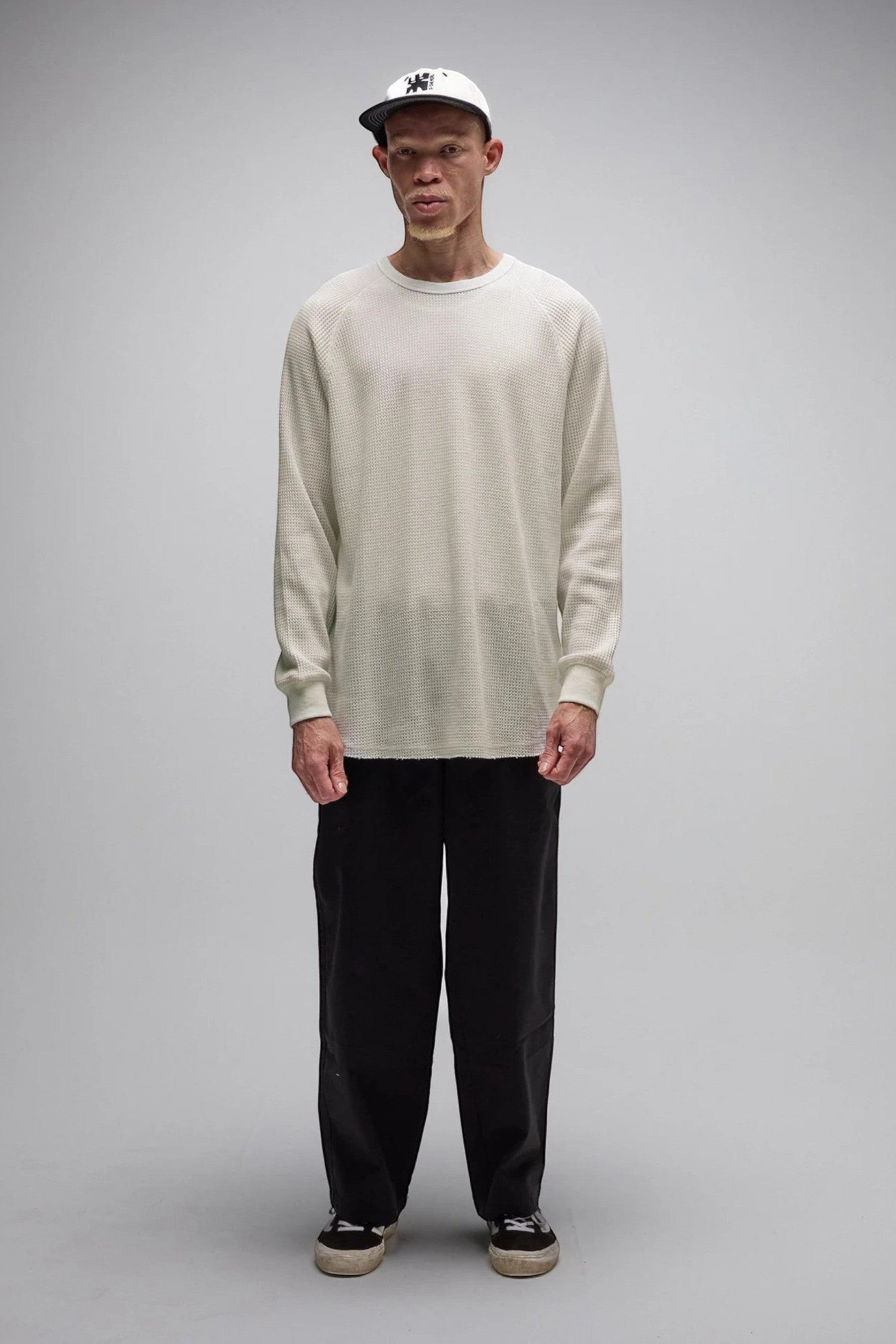 Keel Surf & Supply AG Raglan Waffle long-sleeve shirt in bone colour. Features waffle knit texture, raglan sleeves, raw hem, and bound collar.