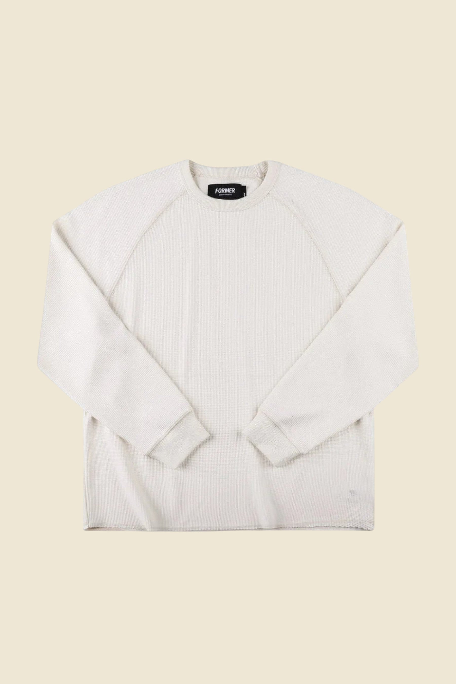 Keel Surf & Supply AG Raglan Waffle long-sleeve shirt in bone white. Cotton-blend with waffle texture, raglan sleeves, and raw hem.