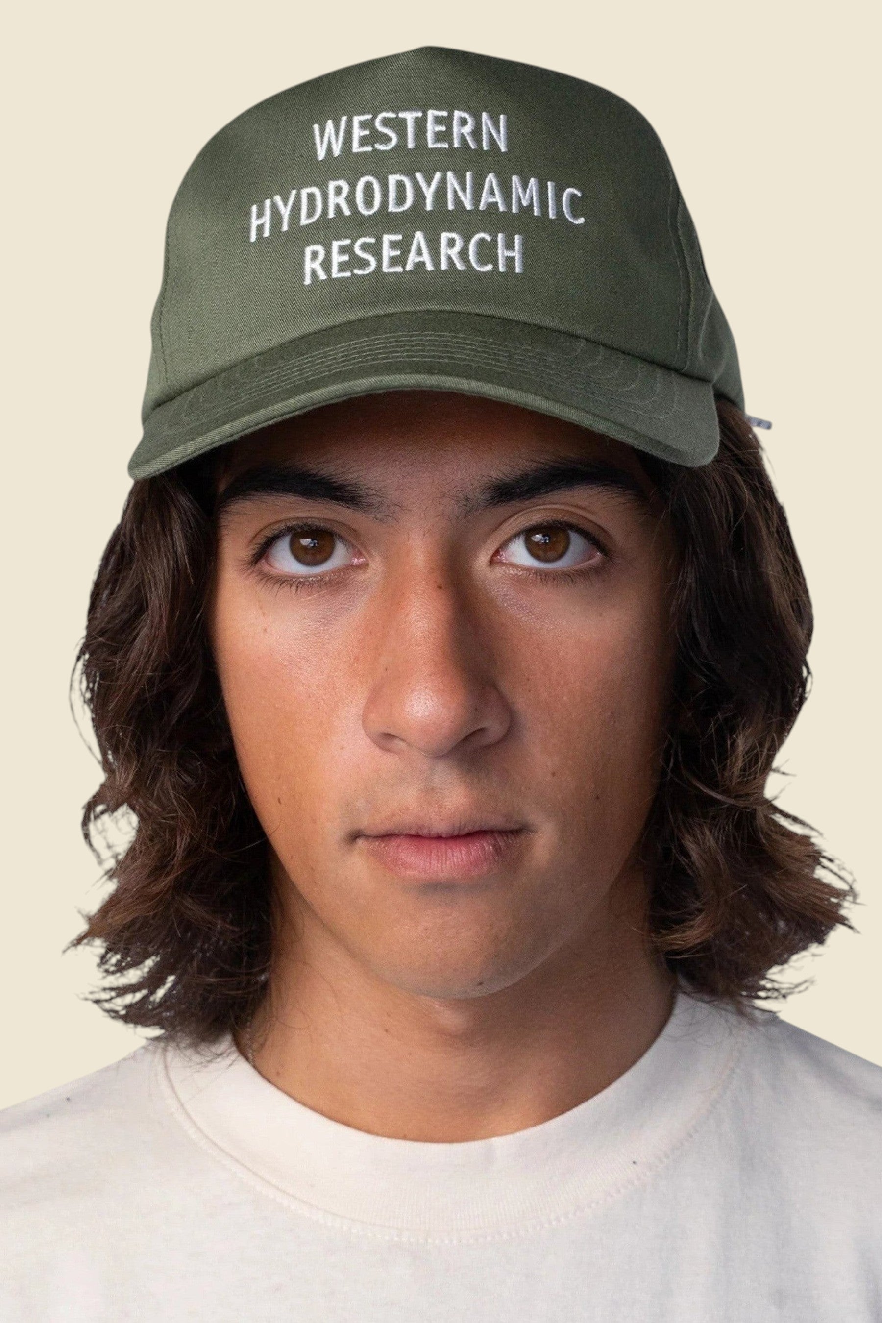 Keel Surf & Supply drab green cotton polyester baseball cap with embroidered Western Hydrodynamic Research logo and bungee closure.