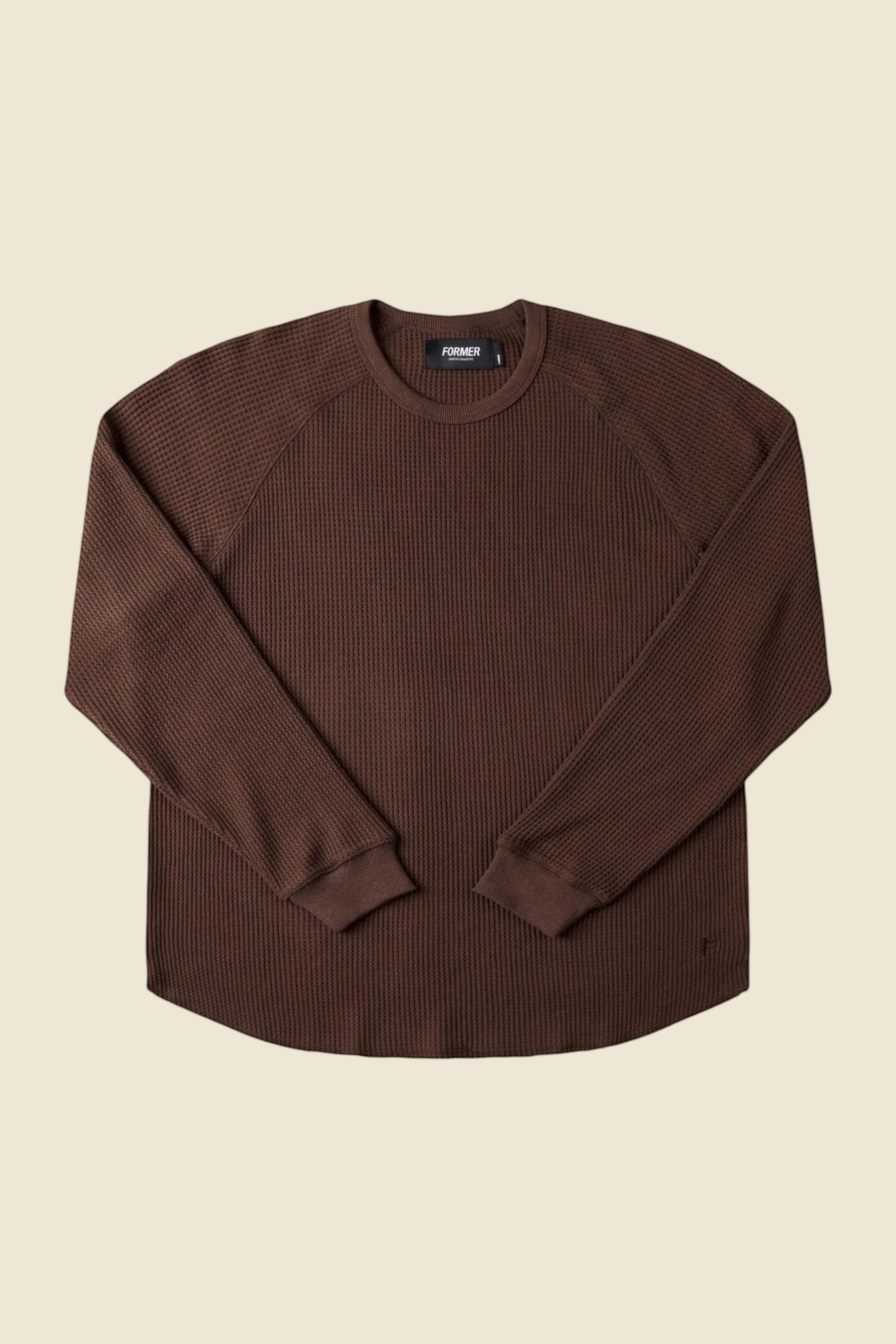 Keel Surf & Supply brown waffle knit raglan long sleeve shirt with raw hem and embroidered logo.