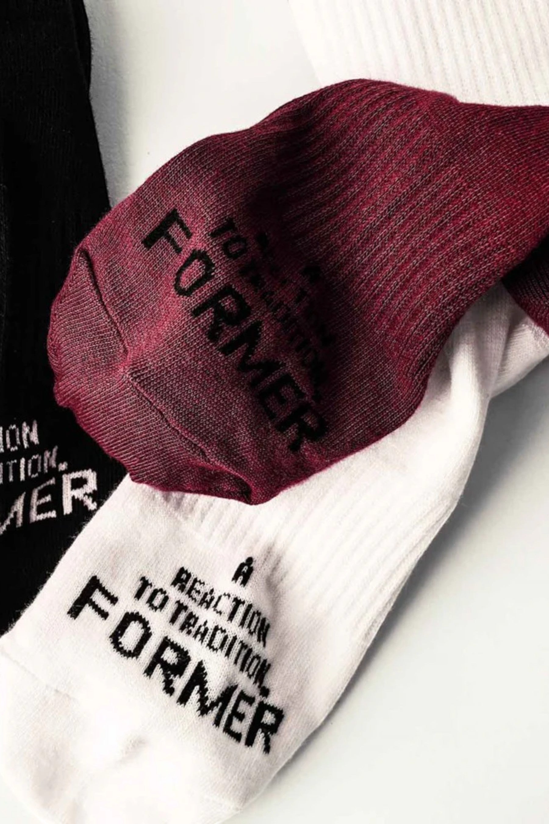 Keel Surf & Supply Franchise 3-pack crew socks in black, white, and burgundy with "FORMER" text detail.
