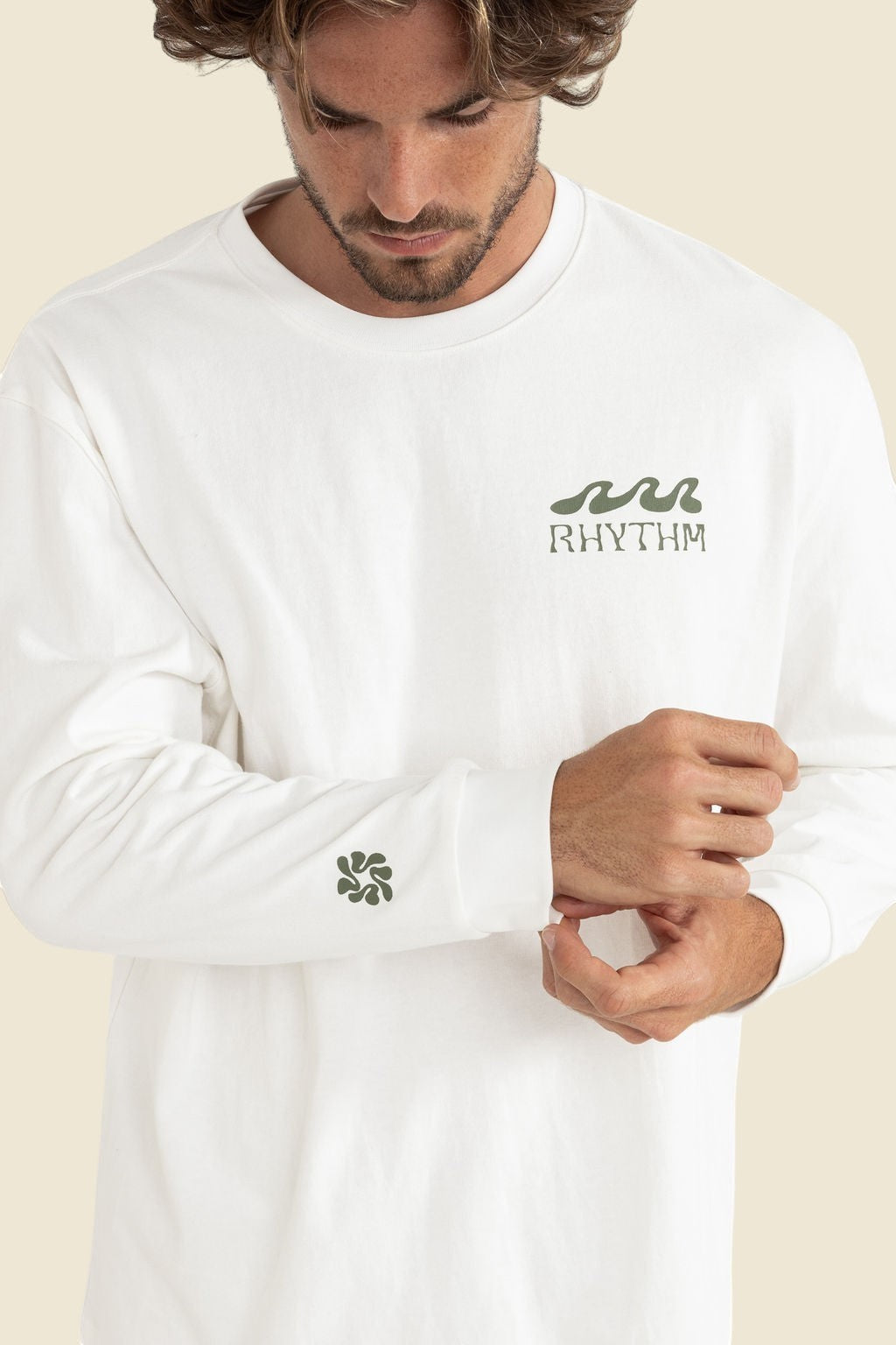 Keel Surf & Supply Grange loose fit long sleeve t-shirt in off-white with green wave logo on chest and cuff.