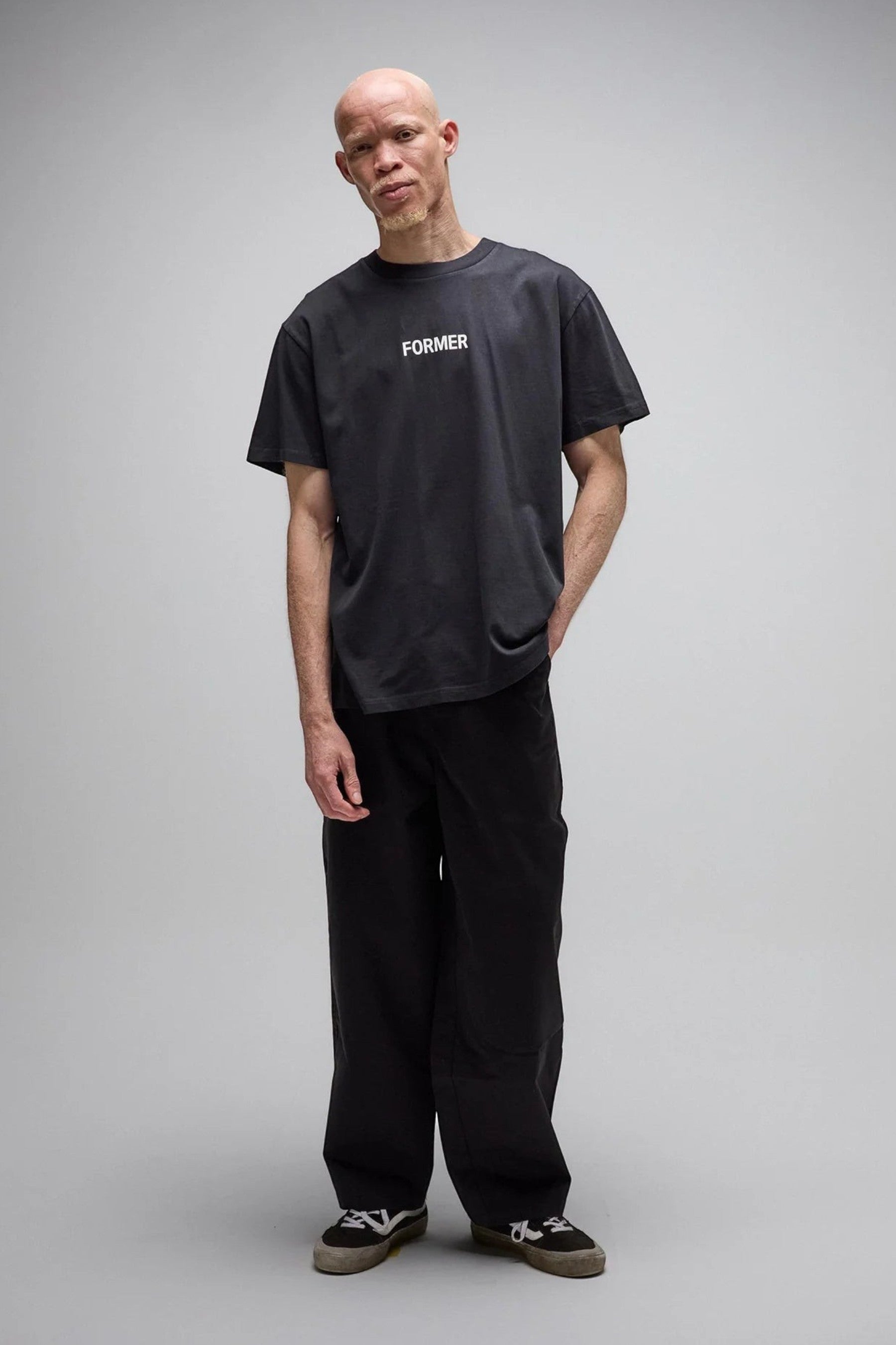 Keel Surf & Supply Legacy Overdye T-Shirt in washed black cotton jersey with front logo graphic. Model wears standard fit.