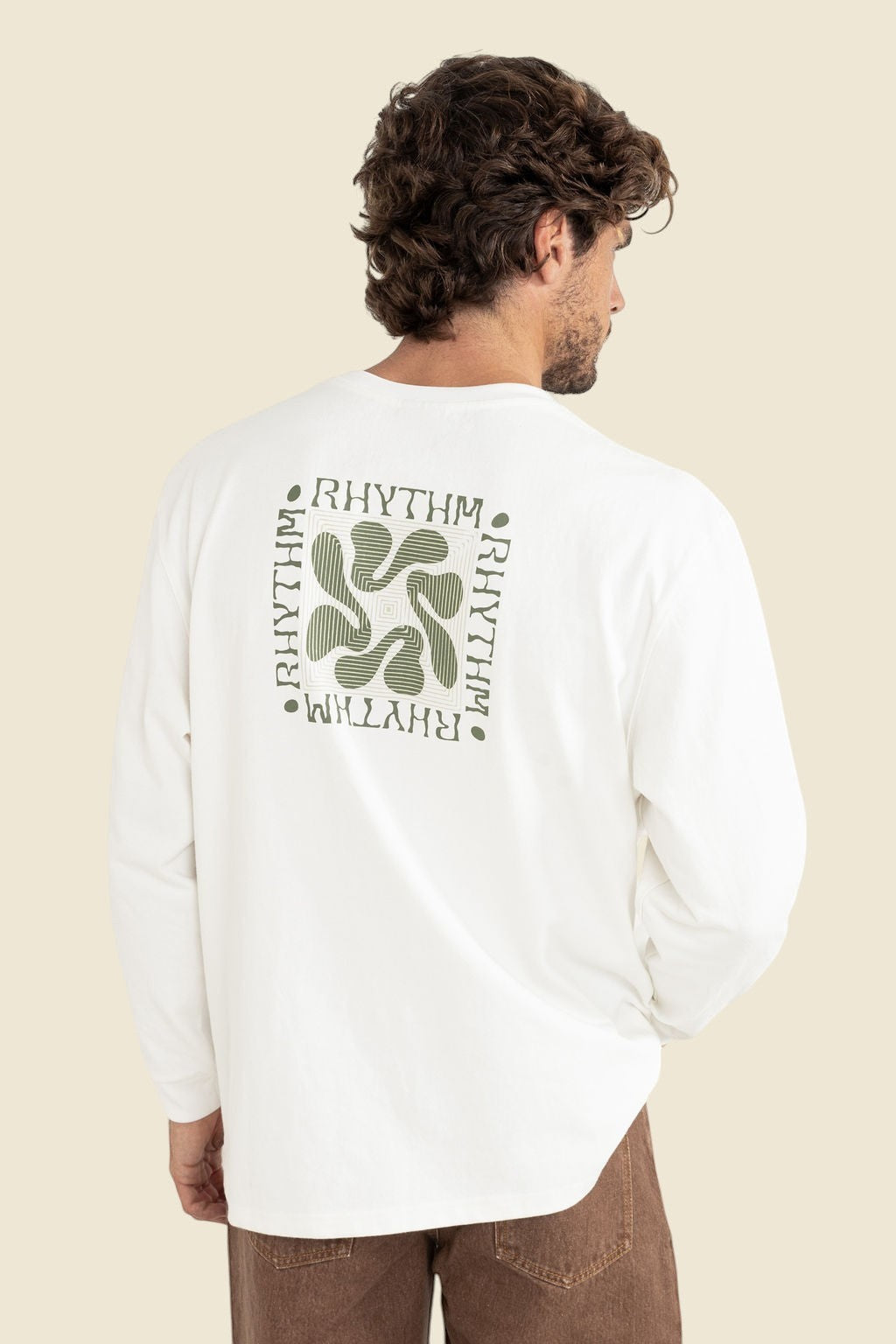Keel Surf & Supply white cotton long sleeve t-shirt with green abstract graphic and text print on back.