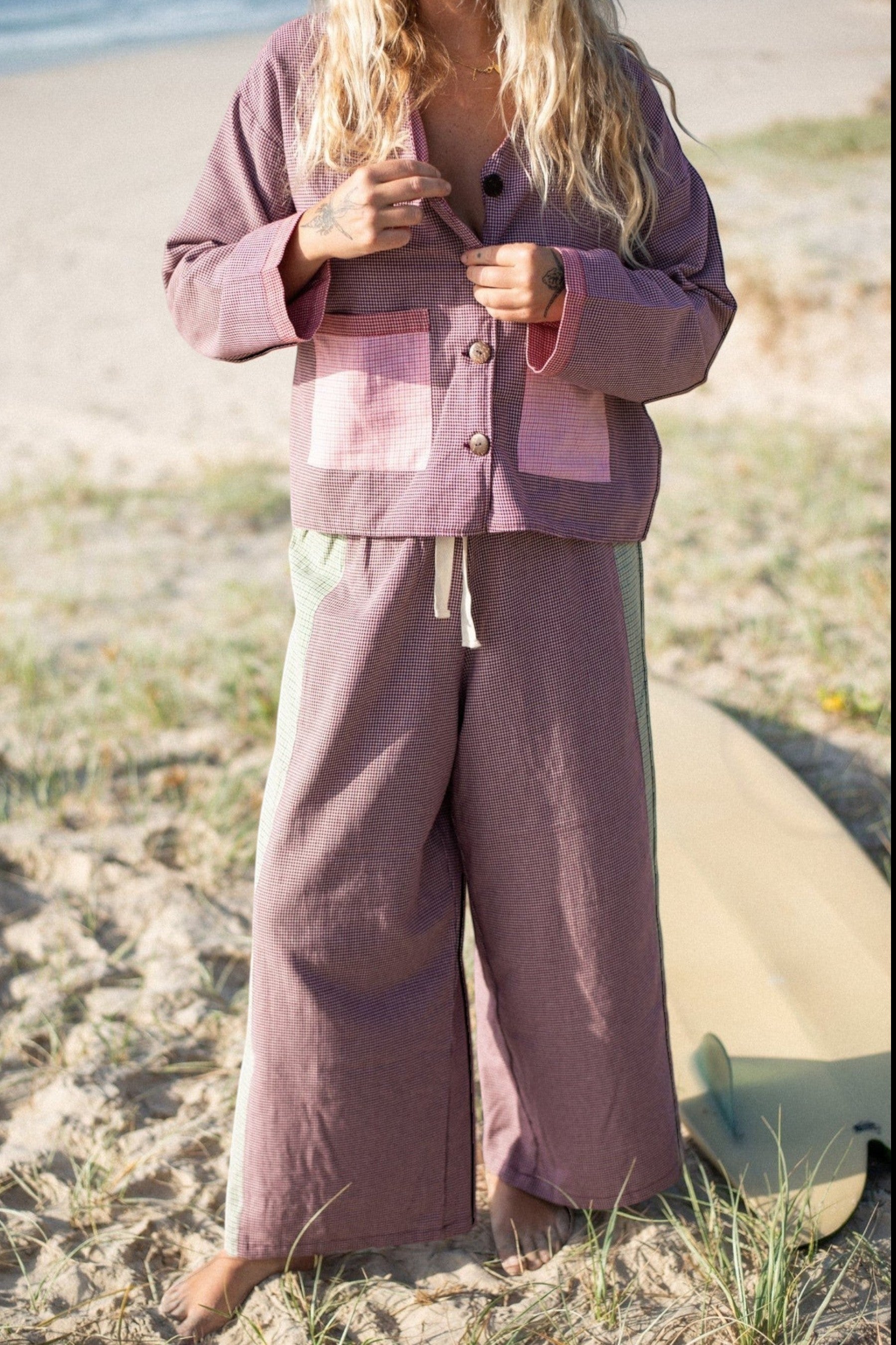 Keel Surf & Supply patchwork overshirt and wide-leg pants in maroon and green houndstooth with pink pocket details.